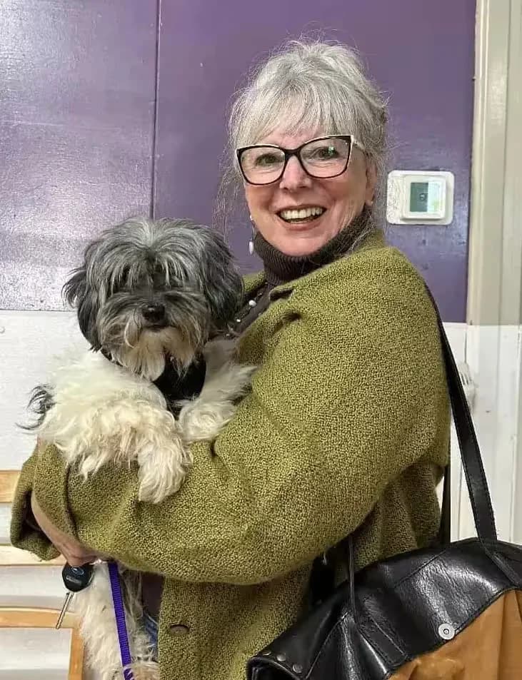 A Start Over Rover volunteer holding a dog